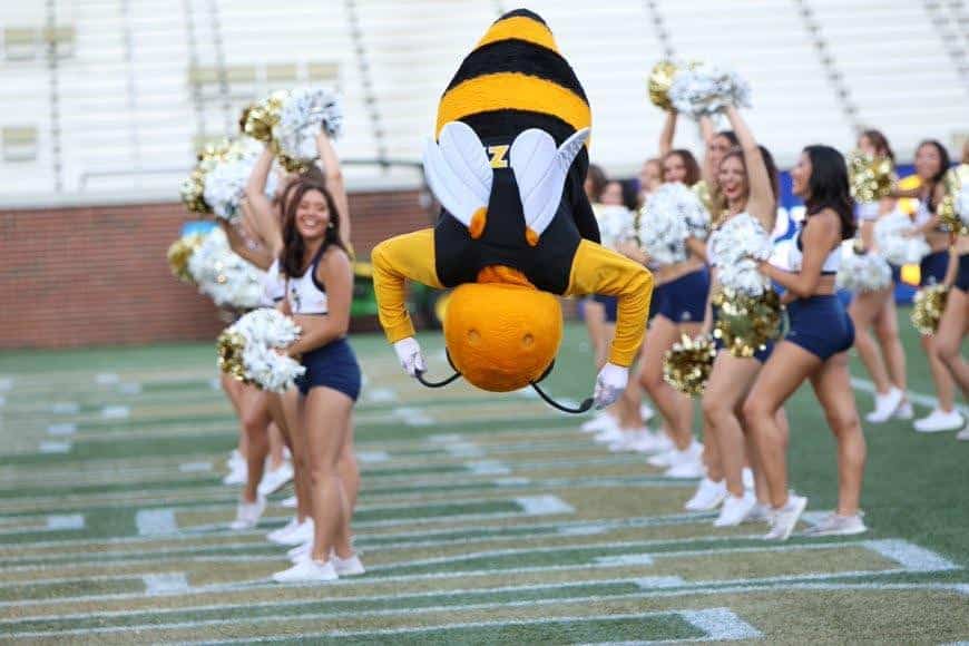 Van, the Mascots and the Cheerleaders