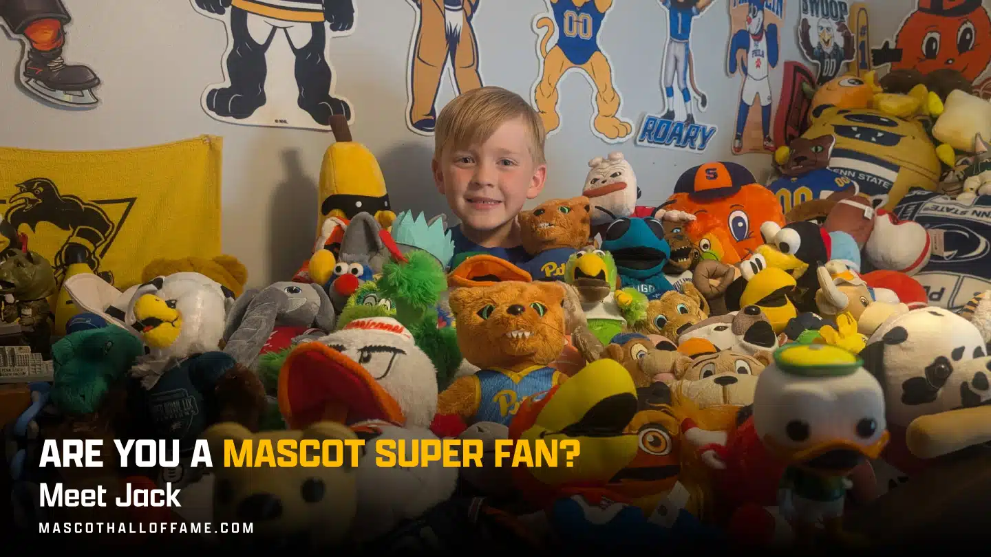 A smiling boy named Jack sits surrounded by dozens of colorful mascot plush toys in a room decorated with mascot posters and pennants. Text reads: Are you a Mascot Superfan? Meet Jack.