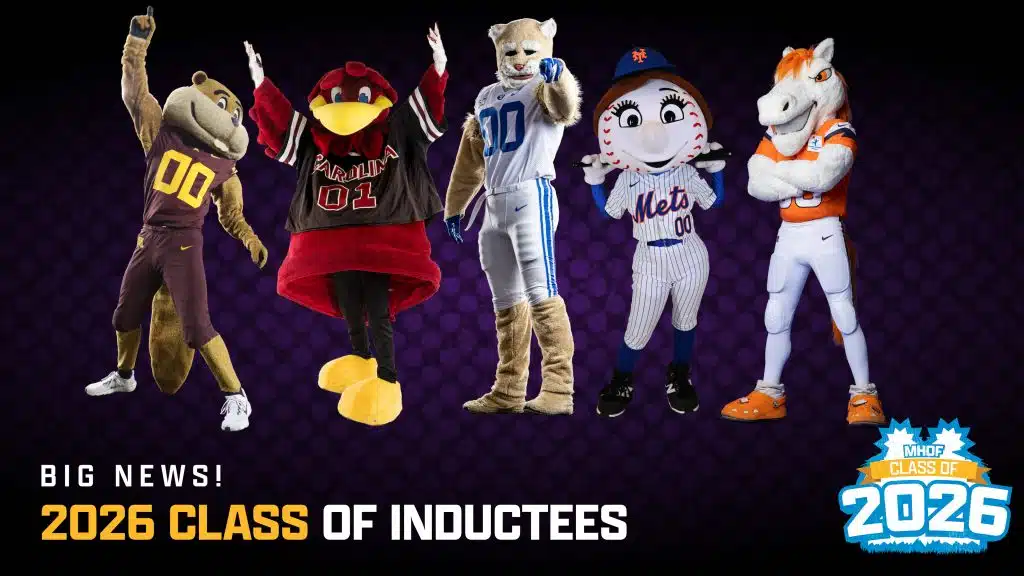 Five sports mascots pose together, celebrating the 2026 Mascot Hall of Fame class of inductees. The announcement text appears beside them on a dark background with a blue and white logo at the bottom right.