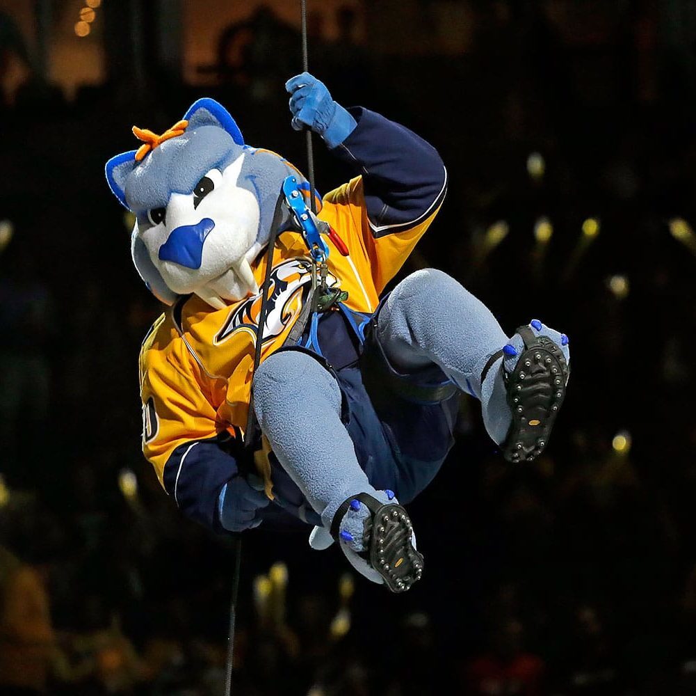 Gnash, the Nashville Predators mascot, rappels down to the ice before Game 4 in an NHL hockey first-round Stanley Cup playoff series between the Predators and the Anaheim Ducks Thursday, April 21, 2016, in Nashville, Tenn. (AP Photo/Mark Humphrey)