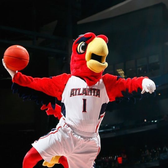 ATLANTA, GA - JANUARY 28:  Harry the Hawk, mascot of the Atlanta Hawks, dunks during a timeout in the game between the Atlanta Hawks and the Brooklyn Nets at Philips Arena on January 28, 2015 in Atlanta, Georgia.  NOTE TO USER: User expressly acknowledges and agrees that, by downloading and or using this photograph, User is consenting to the terms and conditions of the Getty Images License Agreement.  (Photo by Kevin C. Cox/Getty Images)